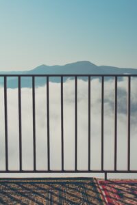 Metal railing with mountain view on other side