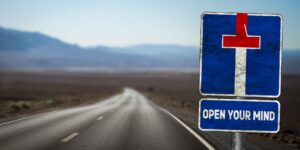 Highway with a sign saying "open your mind"